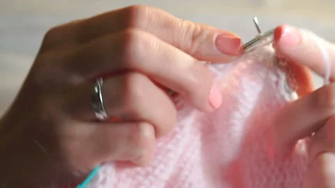 Tying loops from wool yarn to knitting needles Stock Footage 89067823