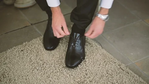 Tying men shoelace Stock Footage 86438652