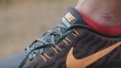 Tying up Nike shoe Video stock 73491283