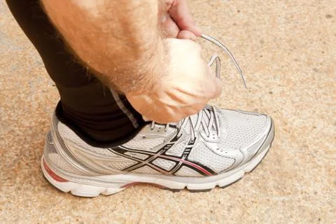 Tying the shoe 스톡 사진