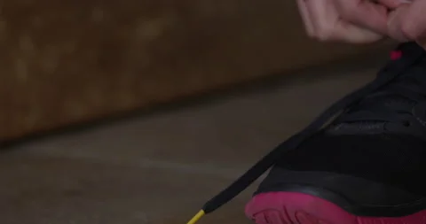 Tying shoelaces on exercise running shoes - close up Stock Footage 148246644