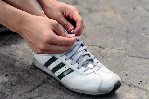 Tying shoelaces Stock Photos