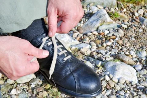 Tying the shoes Stock Photos