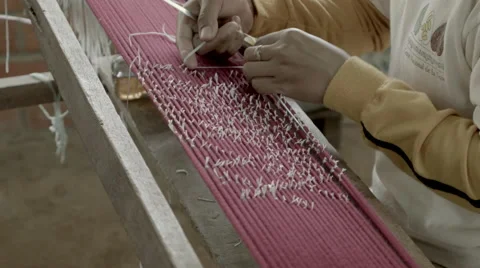 Tying off silk fabric in preparation for dying Stock-Footage 48012653