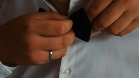 Tying Someones Bow Tie Stock Footage 106211011