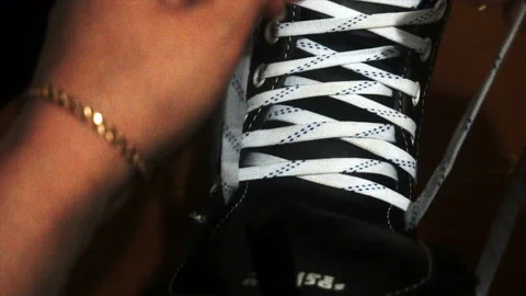 Tying the white laces on skates,preparing to go on the ice Stock Footage 85598409