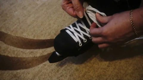 Tying the white laces on skates,preparing to go on the ice Stock Footage 85598968