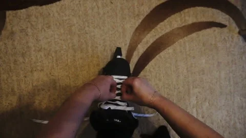 Tying the white laces on skates,preparing to go on the ice 스톡 동영상 85599529