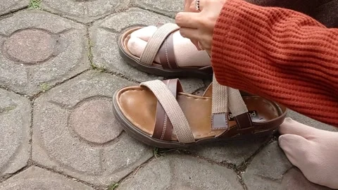 Tying a white shoe on a ground Stock Footage 146254047