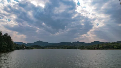 Tyndall Rays Over Shimmering Lake Surface 4K Timelapse Stock Footage 320449657