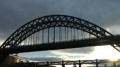 Tyne bridge in low winter sun light pan down to Quayside Stock Footage 1102340