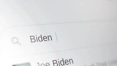 Type and search Biden vs Trump on Google browse Search bar. Stock-Footage 279890363