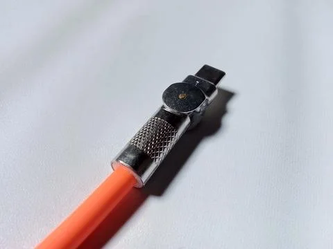 Type C cable is orange isolated white. Фото