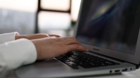 Type the code with the notebook keyboard Stock Footage 196537457