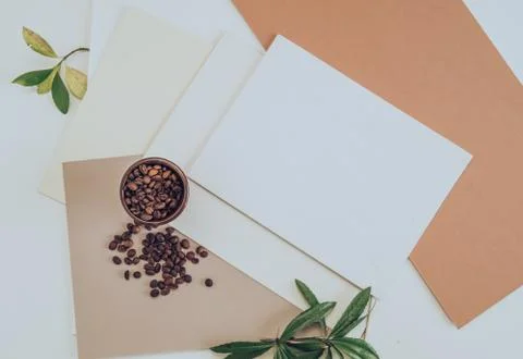 Type of desktop with papers. a jar of coffee and green leaves, top view Stock Photos