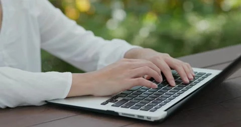 Type on laptop computer at outdoor Stock Footage 132167064