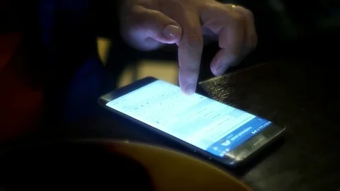 To type a message with your finger on the phone screen. slow motion, 1920x1080 Stock Footage 78935955