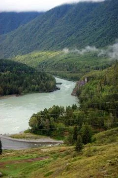 Type with mountains on greater and tempestuous river Stock Photos
