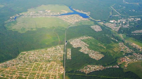 Type of settlements with flying airplane Stock Footage 52889304