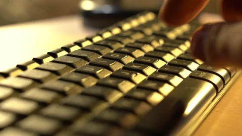 Type text on the keyboard. Closeup fingers pressing buttons on keyboard. Male Stock Footage 141528652