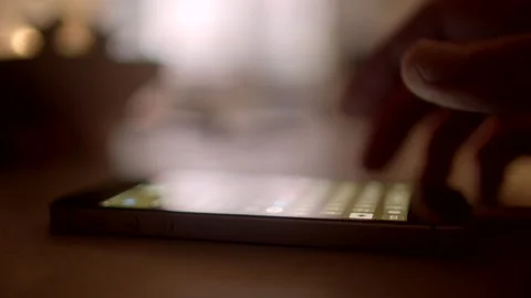 Type text in phone message, finger on screen A finger carefully interacting with Stock Footage 295932537