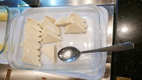 This type of triangle tofu is soft and very popular in Asia Stock Photos
