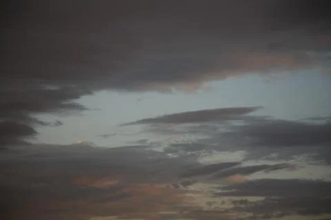 The types of clouds in the sky depend on the wind speed. Stock Photos