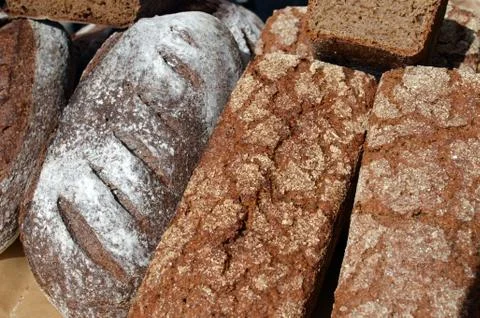 Types of dark brown rye bread baked in Russia exposed at food market Stock Photos