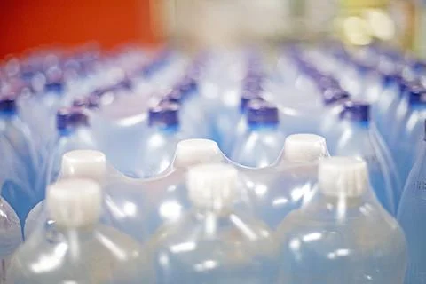 Types of drinking water in plastic bottles in supermarkets. Health care. Stock Photos