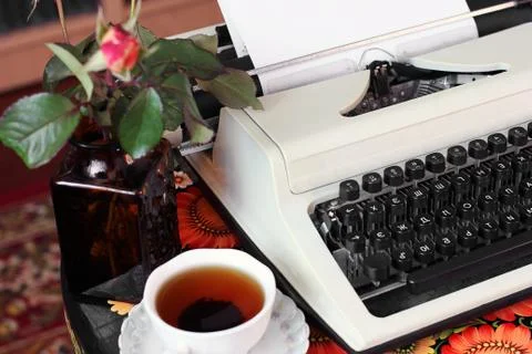 Typewriter and cup of tea. Workplace Fotos Stock