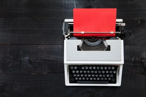 Typewriter and red paper Stock Photos