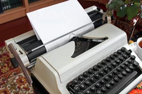Typewriter on an antique table Fotos Stock