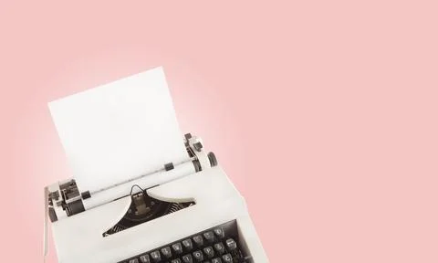 Typewriter with blank paper as a copy space. Retro concept against pink bac.. Stock Photos