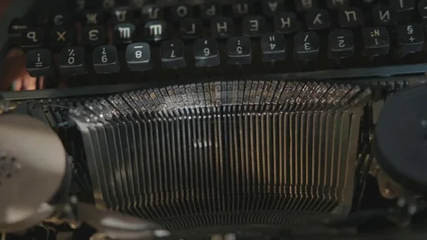 Typewriter device: a man types on a typewriter, the mechanism moves. Stock-Footage 116673911