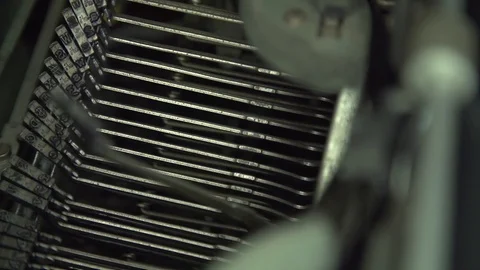 Typewriter hammers as they hit from the side Stock Footage 92525620