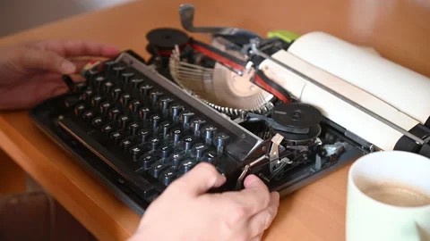 In a typewriter, a sheet is laid and typing begins Stock Footage 132107592