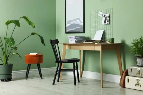 Typewriter, stack of papers and mood board on wooden table near pale green .. 스톡 사진
