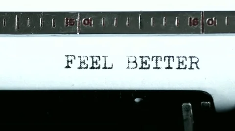 Typewriter. Typing text: feel better Stock Footage 47938722