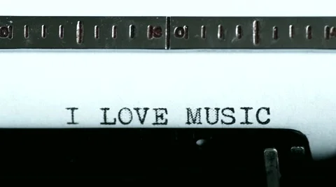 Typewriter. Typing text: i love music Stock Footage 47938541