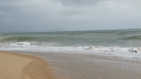 Typhoon winds on sanya beach, waves, blowing sand, day bright, stormy Stock Footage 115241767