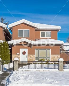 A typical american house in winter. Snow covered house Stock Photos