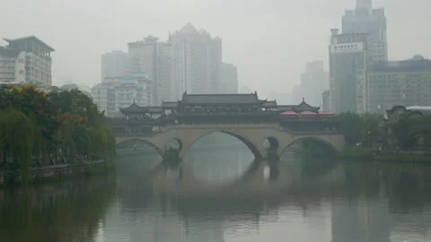 Typical and authentic bridge in Beijing, surrounded by buiding, in China Stock Footage 231857704