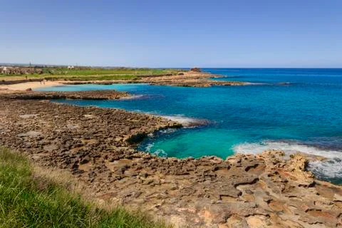 Typical Apulia beach that alternates cliffs to sandy coves, Italy Stock Photos