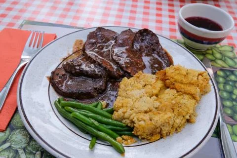 Typical authentic Brasato, beef stew, with polenta and a famous ceramic Stock Photos