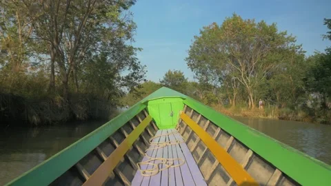 A typical boat sails at high speed in a Myanmar river Stock Footage 236745662