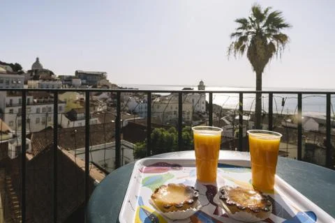 Typical breakfast with Pasteis de Belem in Lisbon Stock Photos