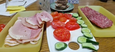 A typical breakfast with sausage, cucumbers, tomatoes and coffee Stock Footage 283684175