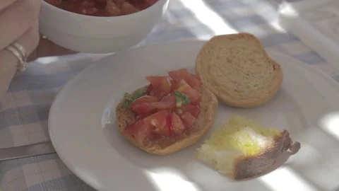 Typical Bruschetta dish with Garlic bread with olive oil and tomatoes Stock Footage 71818564