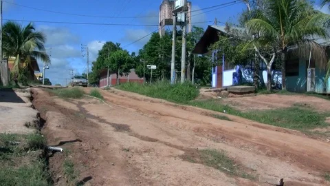 A typical cab through a rough road in a native amazonian village Stock Footage 88439116