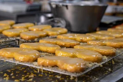 Typical cake called egg palm on a grid tray in a pastry shop Stock Photos